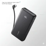 Black Anker Zolo 10000mAh power bank showing digital battery display, 22.5W fast charging icon, and built-in USB-C cable charging a phone.